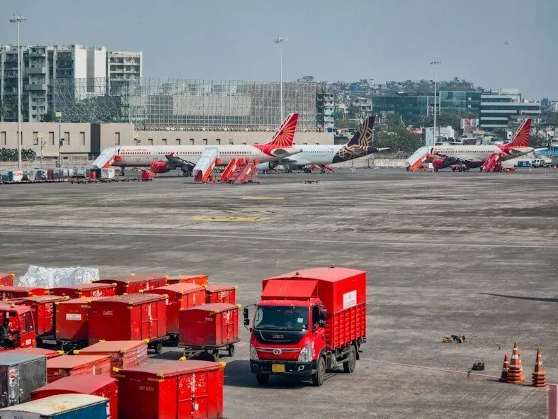 Hans Air Express cargo vehicles at Mumbai airport for international shipments